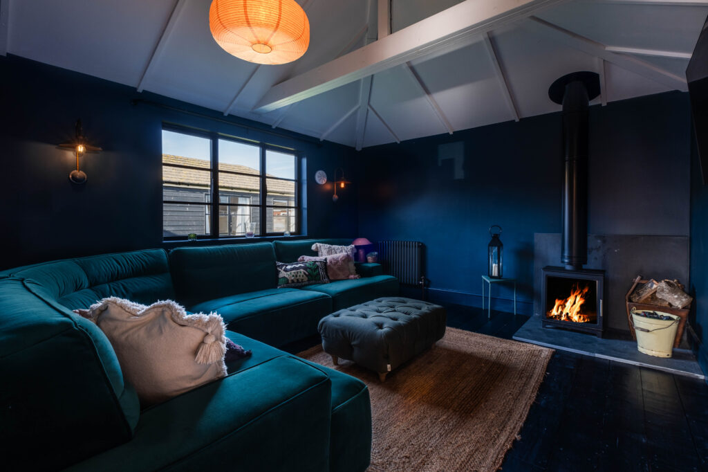 The cosy and warm snug with its open fire at Seagrass 