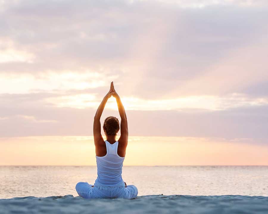 Relax and do yoga on the beach in Camber Sands