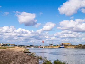 Listen to the boats clinking on the calm waters of Rye Harbour